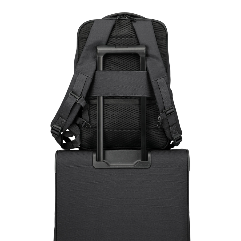 Lieblingstasche Skaii Rucksack M in black, showing the back panel with trolley sleeve attached to a suitcase handle.