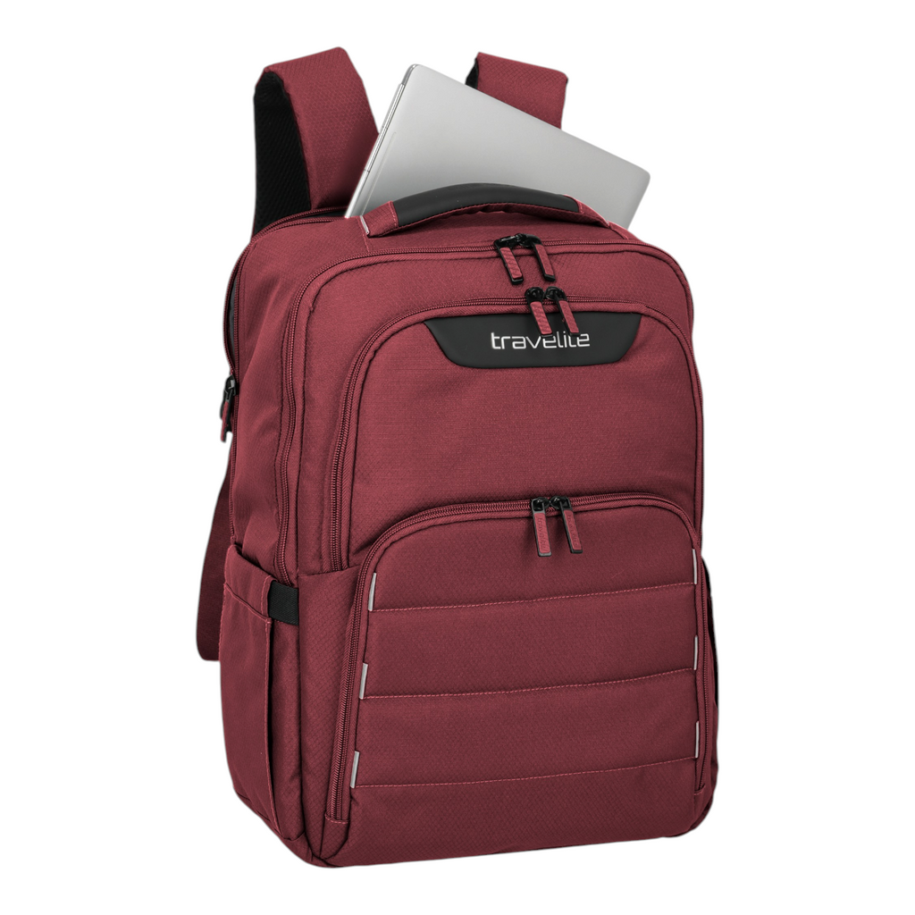Lieblingstasche Skaii Rucksack M in dark red with a laptop inside, featuring multiple zippered compartments.