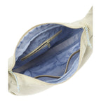 Lieblingstasche sling bag interior view showing light blue lining, zippered pockets, and mesh compartments.