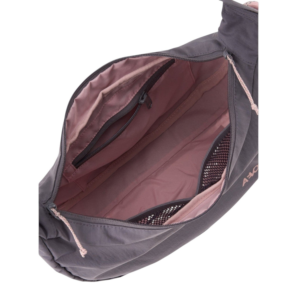 Lieblingstasche sling bag interior with grey exterior, dusty pink lining, zipper pocket, and mesh compartments.
