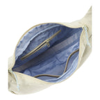Lieblingstasche sling bag interior view showing light blue lining, zippered pockets, and mesh compartments.