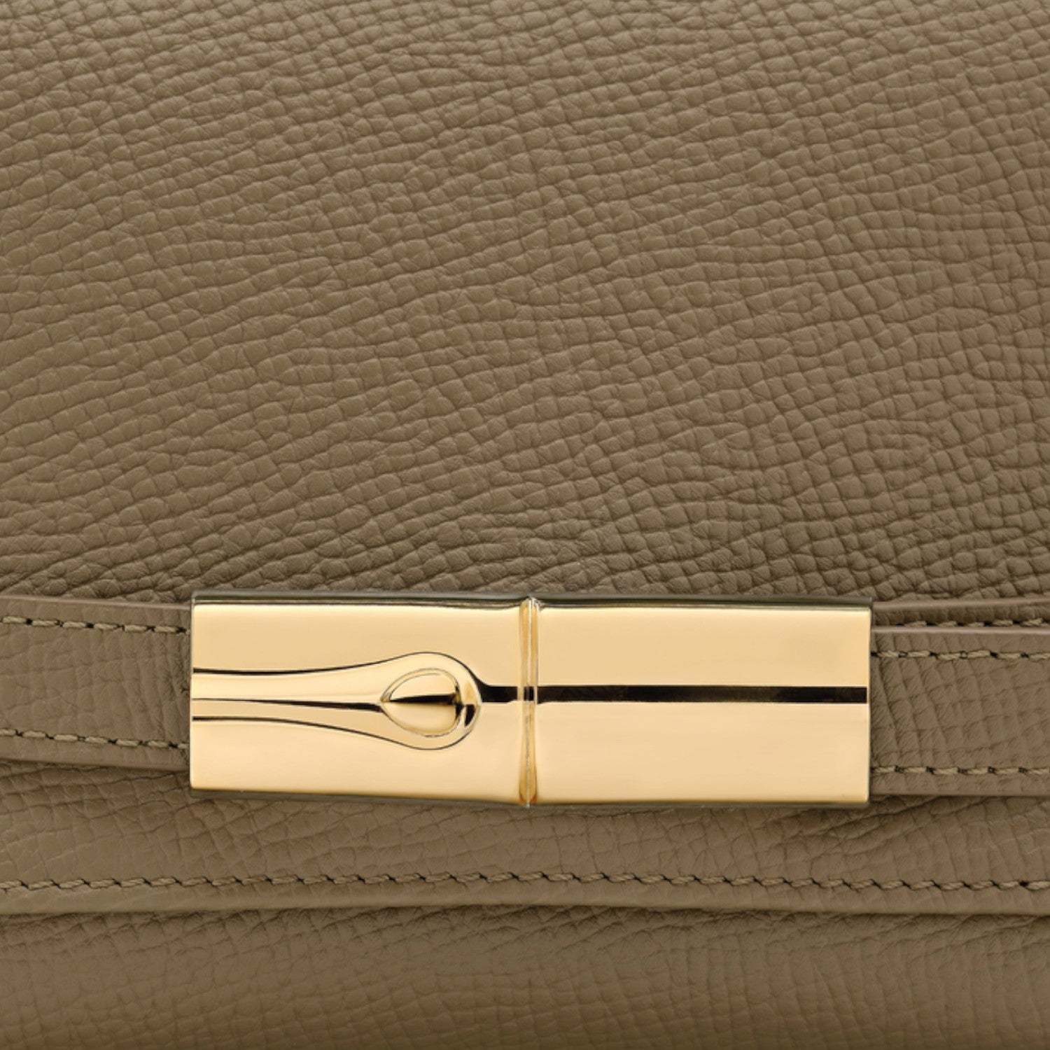 Lieblingstasche Le Smart Flow S crossbody bag in taupe grained leather with a gold-tone metal clasp detail.