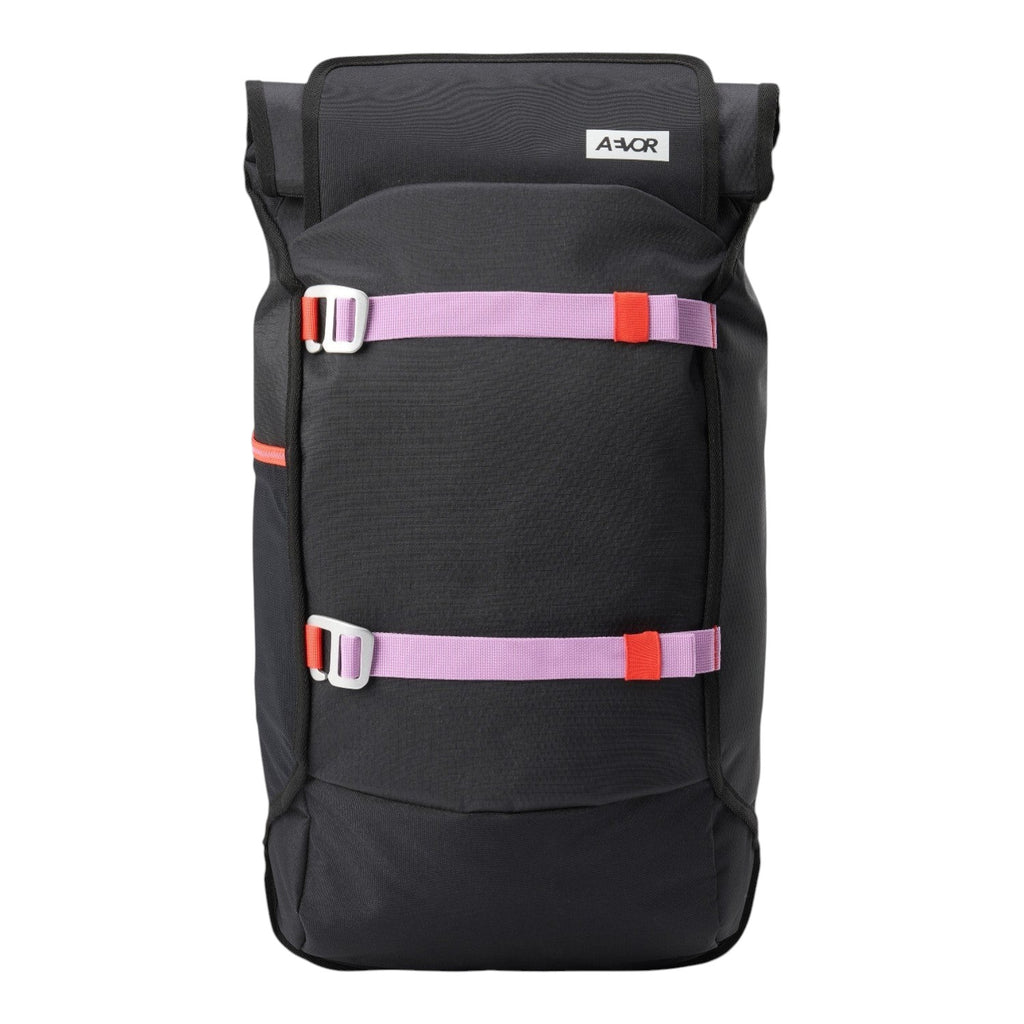 Lieblingstasche Trip Pack black backpack with roll-top closure and contrasting purple and orange strap details.