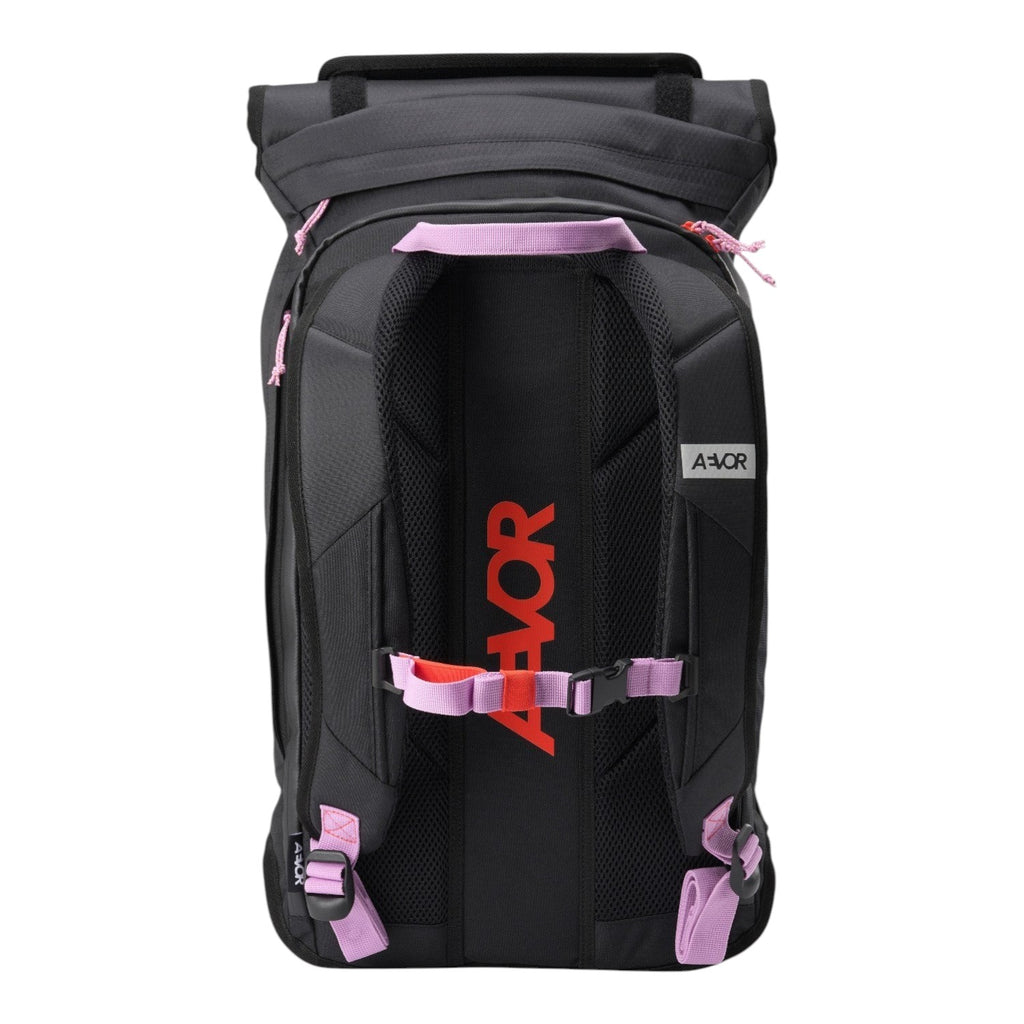 Lieblingstasche Trip Pack backpack in black with pink accents, featuring adjustable straps and breathable back panel.