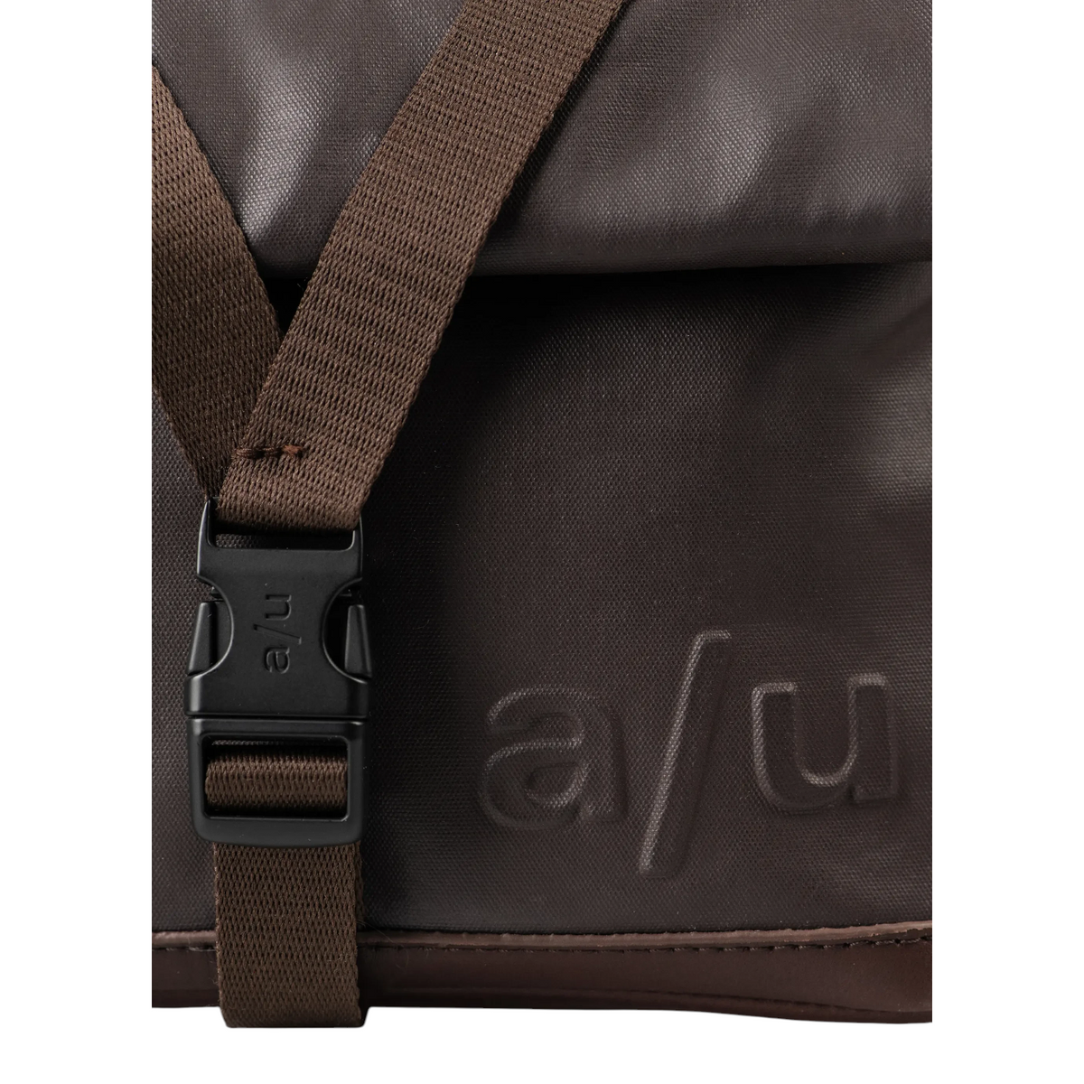 Lieblingstasche Tsu brown messenger bag with a black plastic buckle and embossed a/u logo detail