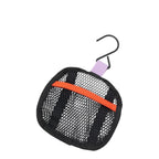 Lieblingstasche Wash Pack featuring a black mesh toiletry bag with an orange strap and a hanging hook.