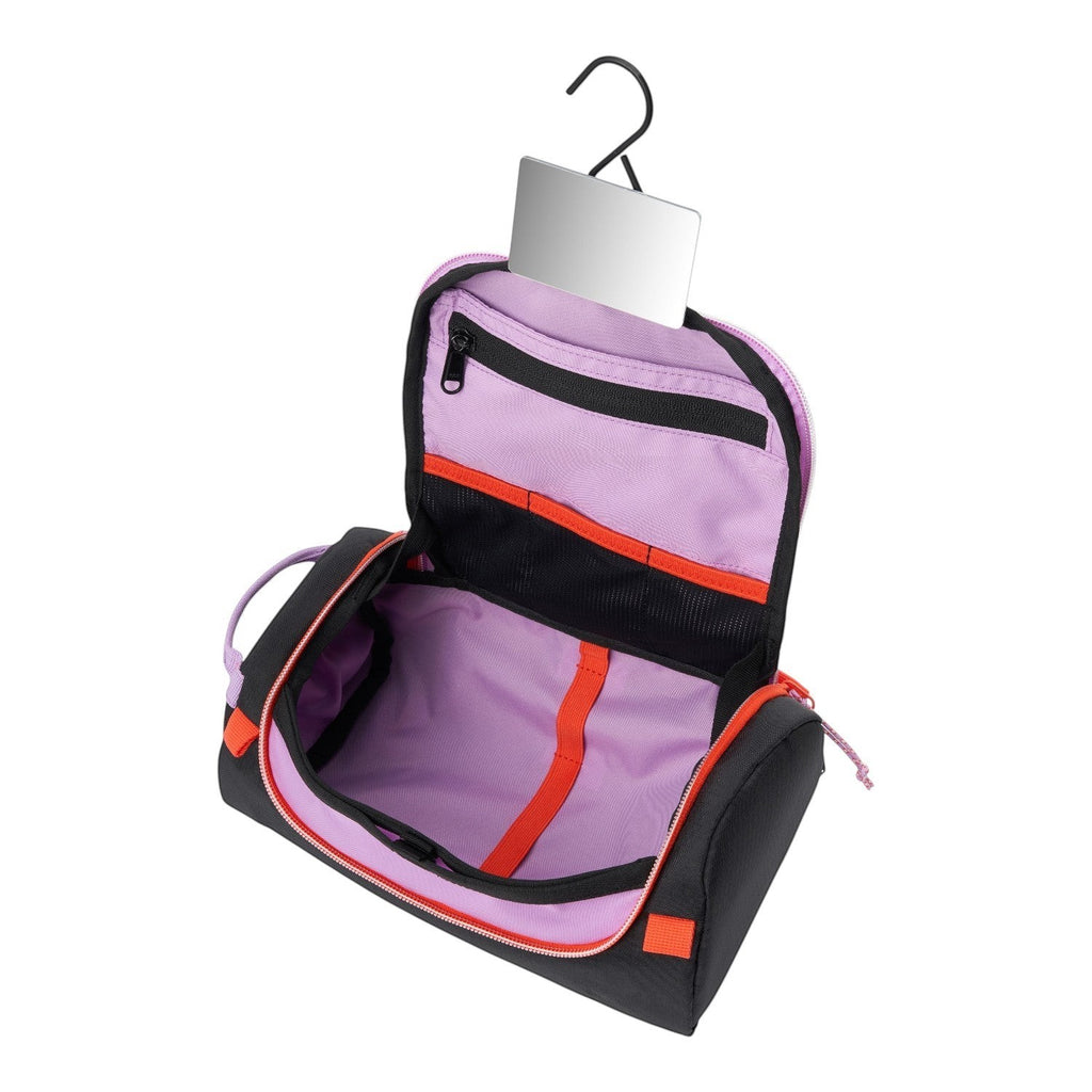 Lieblingstasche Wash Pack in black and lavender with an integrated mirror and hanging hook for travel organization.