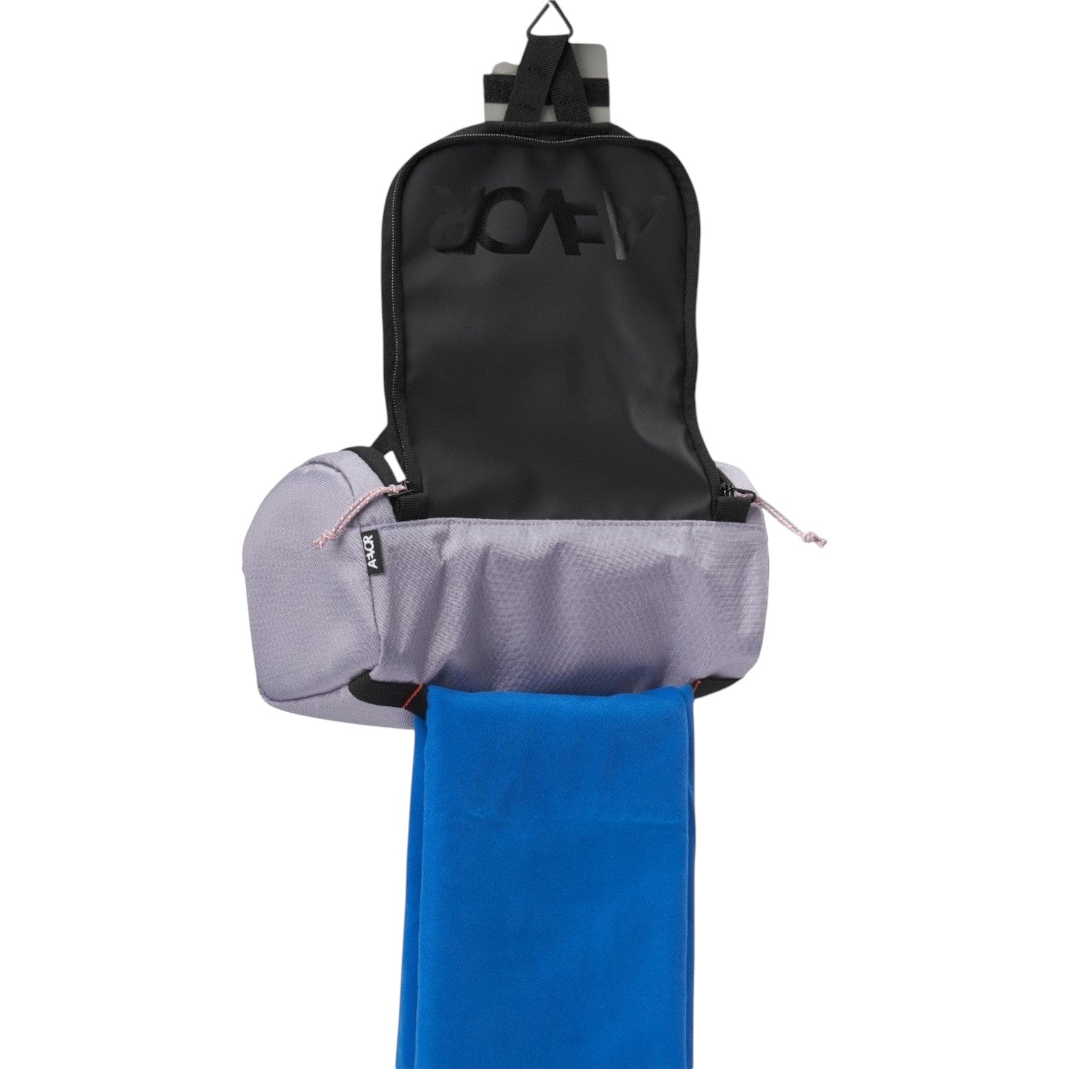 Lieblingstasche Wash Pack in light purple with a hanging hook, open compartment, and a blue towel attached.