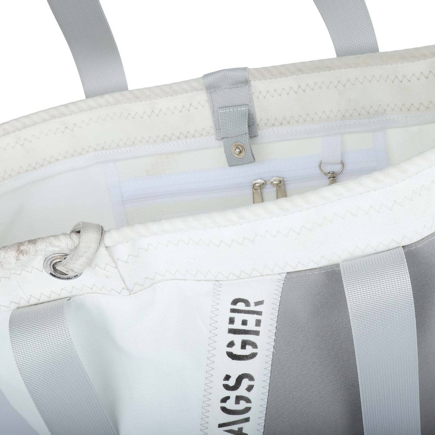Lieblingstasche white and grey tote bag with grey straps and silver hardware. Interior features zip pockets and a key clip.