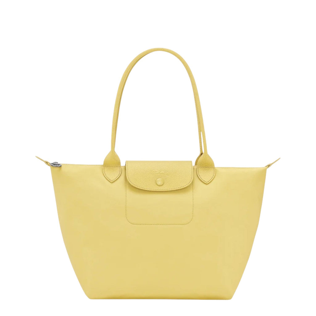 Lieblingstasche yellow leather tote bag with snap closure pocket and top handles.