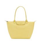 Lieblingstasche yellow leather tote bag with snap closure pocket and top handles.