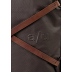 Close-up of the Lieblingstasche Yokohama dark brown synthetic bag with embossed a/u logo and brown leather straps